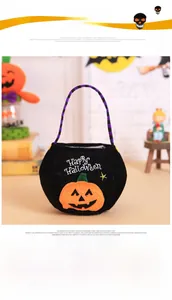 Detail of Halloween pumpkin candy bag with orange embroidery and purple striped handle