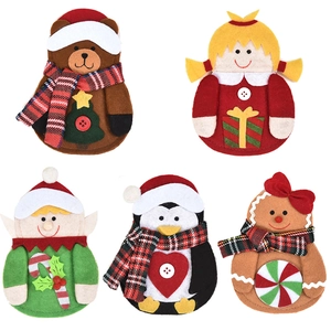 Christmas character felt cutlery bags featuring Santa, gingerbread man and penguin designs