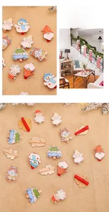 Macro detail of Christmas wooden clips featuring hand-painted snowmen and angel figures