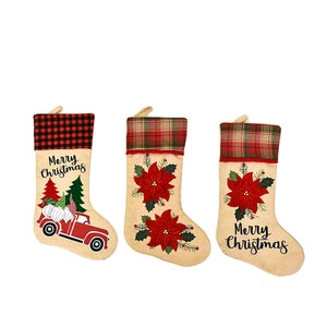 Three-piece set of burlap Christmas stockings with gnome truck and Merry Christmas embroidery