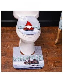 Detail view of gnome themed Christmas toilet cover and U-shaped rug set in snow blue