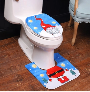 Close-up of sky blue and red gnome Christmas toilet cover set with plush fabric texture