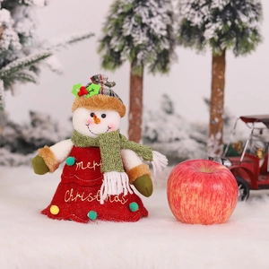 Embroidered snowman doll with Merry Christmas text on skirt and red plaid hat