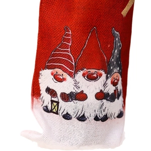 Red burlap Christmas wine bottle bags with three cute gnome prints for holiday table decor