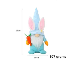 Close-up of Easter blue gnome doll with bunny ears holding a carrot, 25cm height