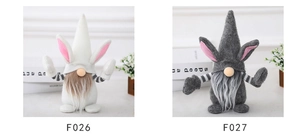 Detail of Easter gnomes with pink rabbit ears, long white beards and striped sleeves