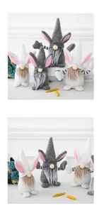 Detail of Easter gnome dolls with rabbit ears and plush beards for home decoration