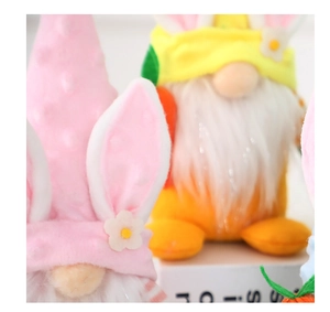 Detail of Easter gnome featuring pink hat with rabbit ears and daisy floral decor