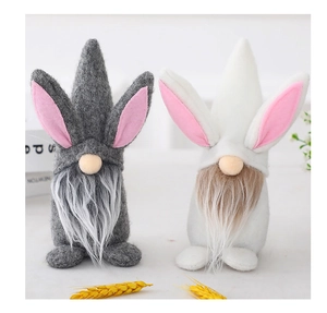 Detail of plush Easter gnomes with rabbit ears, long white beards and round wooden noses