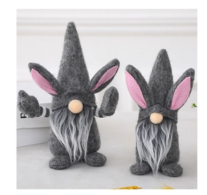 Detail of two Easter gnome plushies with grey felt bodies and long white faux fur beards