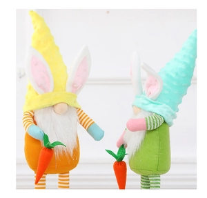 Detail of Easter gnomes with rabbit ears and carrots in yellow and cyan felt