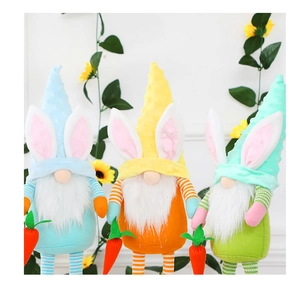 Detailed view of three Easter Gnomes with rabbit ears, long beards and holding carrots