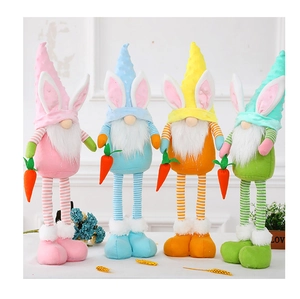 Detailed view of four colorful Easter gnomes with rabbit ears holding small carrots