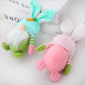 Easter gnome plush pendants with rabbit ears and carrot detail in pink and green