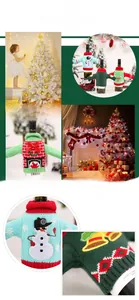 Detail showing knitted Christmas wine bottle covers with reindeer and snowman embroidery
