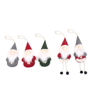 Five assorted Christmas gnome ornaments with long white beards and hanging rope loops