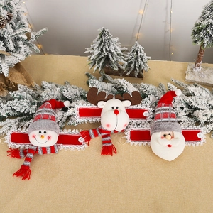 Three Christmas curtain buckles featuring Santa, snowman, and reindeer figures in plush fabric