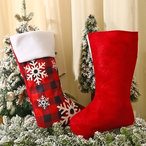 Large red and black buffalo plaid Christmas stocking with snowflakes and plush trim decoration
