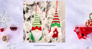 Close-up of red and green Christmas gnome hanging ornaments with soft faux fur beards