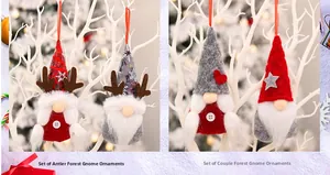Detail view of antler and heart gnome pendants with red hanging strings for Christmas decor