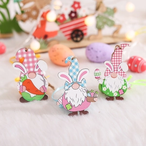 Easter wooden gnome ornaments with rabbit ears holding eggs and carrots, set of 3