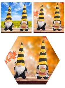 Detail of bee festival gnome plush set with honey pot and stirrer in garden setting