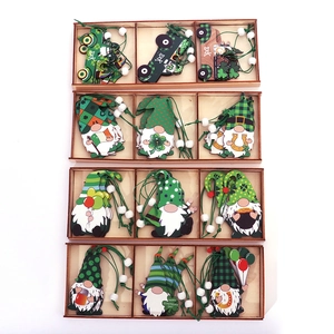 St. Patrick's Day wooden gnome ornaments set with clover designs in a display tray