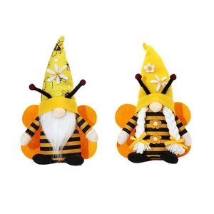 Pair of honey bee festival gnomes with wings and sunflower decorations on white backdrop
