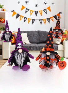 Three Halloween gnomes with bat and skull hats in a cozy indoor festive setting