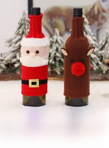 Detail of knitted Christmas wine bottle covers featuring Santa Claus and reindeer designs