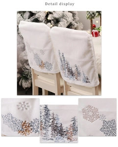 Macro detail of white plush Christmas chair cover with embroidered snowflake patterns