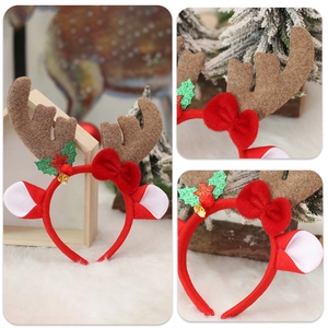 Christmas reindeer antler headband with red bow, green holly leaves, and golden bells