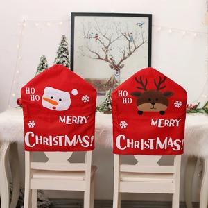 Christmas chair covers featuring snowman and reindeer designs for festive dining room decor