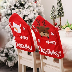 Red Christmas chair covers with snowman and reindeer patterns for festive dining decor