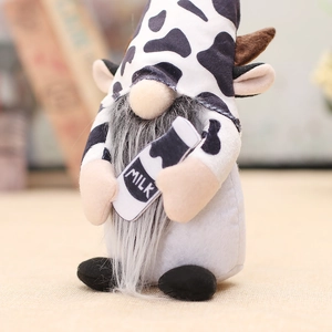 Cow themed gnome plush with milk bottle and deer horns for home decor display