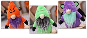 Three plush Halloween gnomes with bat wings and pumpkin themes on wooden bases