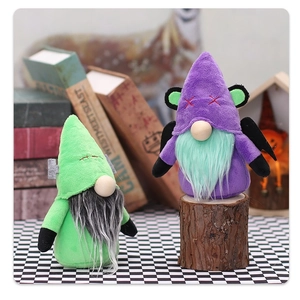 Detail of Halloween gnome plush dolls with bat wings and Frankenstein stitching textures