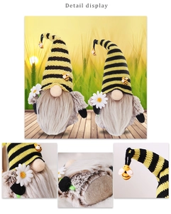 Detailansicht der Hummel-Gnom mit gestreifter Stricktextur und weißem Gänseblümchen