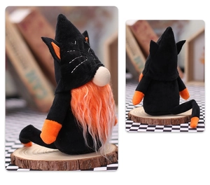 Detail view of Halloween gnome plush toy with black cat costume and orange beard