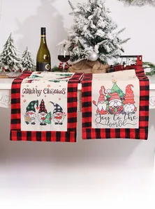 Detail of Christmas gnome table runner with buffalo plaid borders and festive patterns