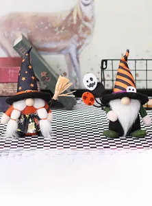 Detail of Halloween gnomes featuring a black star hat and a striped hat with mini broom