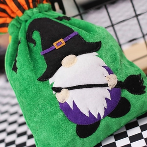 Green velvet Halloween gnome drawstring candy bag with detailed embroidery and wizard hat