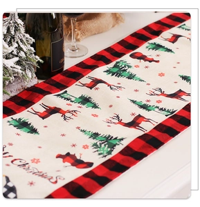 Detail of Christmas table runner featuring reindeer, trees and Merry Christmas text