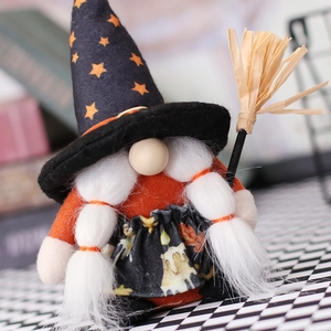 Halloween gnome plush with black wizard hat and mini broom on checkered surface