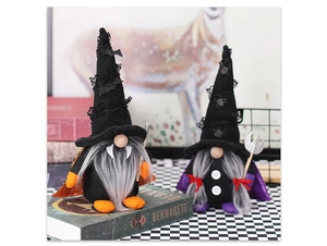 Detailed close-up of handmade Halloween gnome dolls with bat and spider decorations