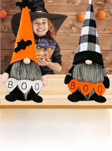 Detail of Halloween gnomes featuring pointed hats with bats and a BOO pumpkin banner