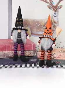 Detail of Halloween gnome plush dolls with pointy hats and festive props on vintage book
