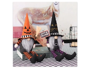 Detail of Halloween gnome couple with pumpkin hat, black cat hat and broomstick