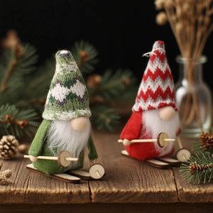 Charming pair of knitted Christmas gnomes on wooden skis with festive winter decor