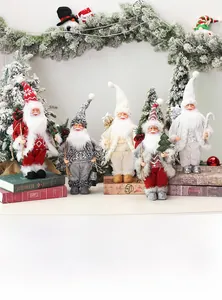 Detail of five Christmas gnome plush set with knit hats and warm festive accessories
